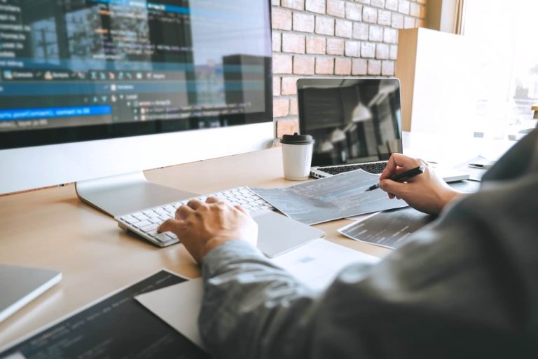 Professional website developer coding and building a high-performance business website, showcasing Alvo Digital's expertise in website design, website development, SEO-ready web solutions, and digital marketing services.