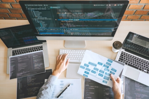 Professional website developer working on software coding, website design, and database development in a modern office, showcasing Alvo Digital's expertise in web development, digital solutions, and business growth technology.